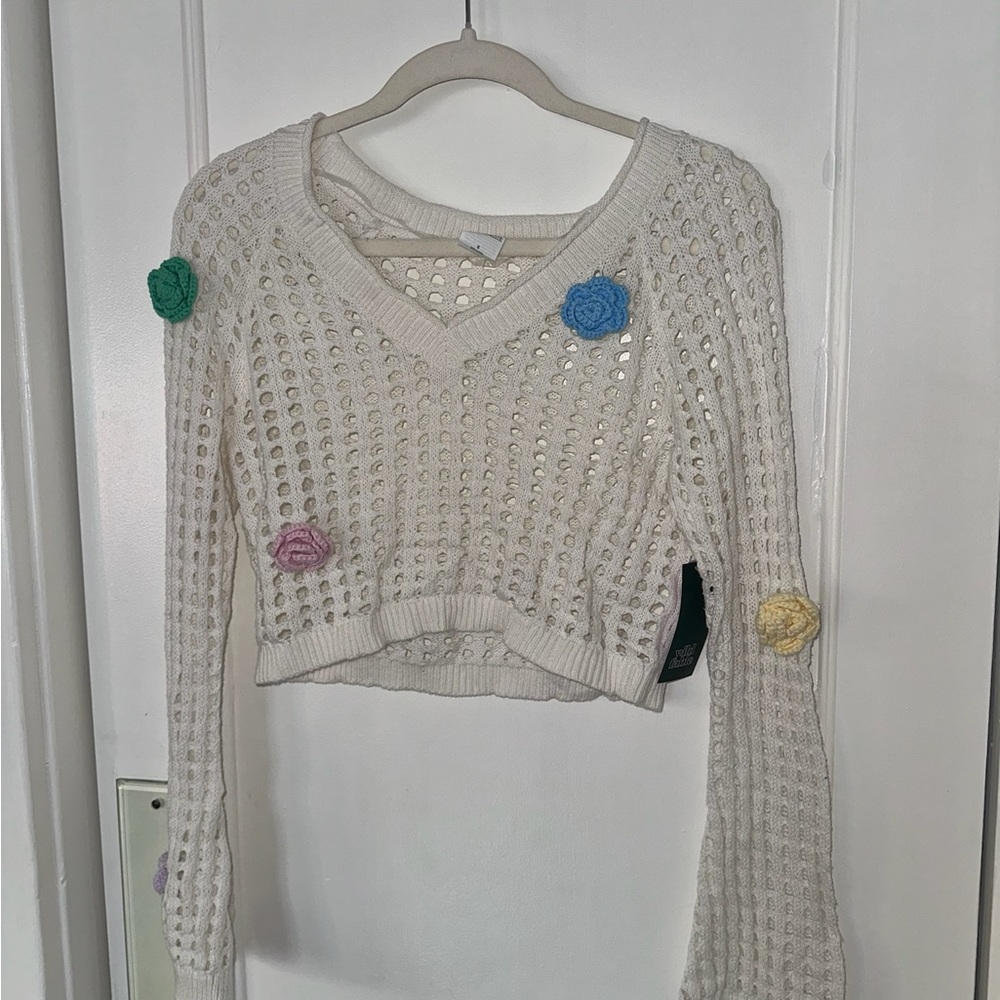 White crochet sweater with flower accents